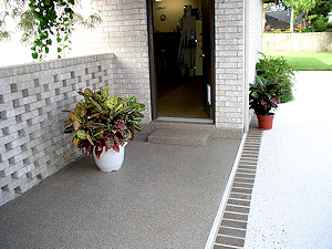 The ColorFlake garage floor epoxy coating has been extended onto the breezeway in this home.