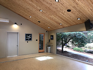 This garage does double duty as a living space extension, and is enhanced by the ColorFlake epoxy floor coating